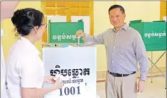  ?? HENG CHIVOAN ?? Prime Minister Hun Manet places his vote in the ballot box at Preah Sisowath High School in Phnom Penh on February 25.