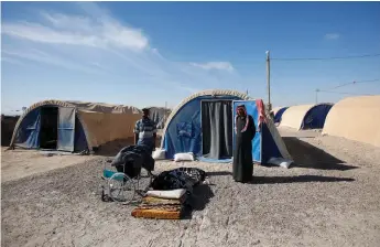  ?? Reuters ?? A displaced Iraqi family at the Amriyat Al Fallujah camp in Anbar Province, Iraq, last week. Some refugees are being forced to return home to areas booby trapped by retreating ISIL fighters