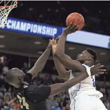  ?? JEFF BLAKE/USA TODAY SPORTS ?? Duke’s Zion Williamson is fouled by UCF’s Tacko Fall in the second half in the battle of the big men.