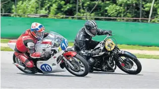  ?? ?? Andreas Ulm passing a Yamaha TZ racer at a race in Brno.