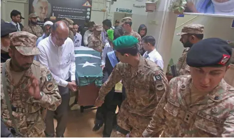  ?? AP ?? Troops and other mourners carry the coffin of German-born anti-leprosy campaigner Ruth Pfau to her funeral in Karachi