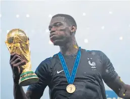  ?? Picture: Getty Images. ?? French midfielder Paul Pogba with the World Cup. The football tournament has been credited with an increase in retail spending.