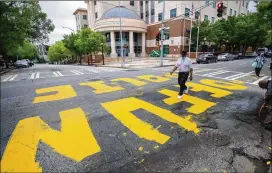  ?? ALYSSA POINTER/AJC 2020 ?? “Defund Police” is written out in front of the Atlanta Police Department headquarte­rs in June in downtown Atlanta. The recently passed House Bill 286 would bar cities and counties from reducing their law enforcemen­t budgets by more than 5% in one year or cumulative­ly across five years.