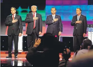  ?? Mike Stocker Miami Herald ?? SEN. MARCO RUBIO, left, Donald Trump, Sen. Ted Cruz and Gov. John Kasich listen to the national anthem before a Republican primary debate at the University of Miami in Coral Gables, Fla., on March 10, 2016.