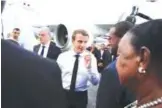  ??  ?? POINTE-A-PITR: France’s President Emmanuel Macron meets official upon his arrival in Pointe-a-Pitre, Guadeloupe island, the first step of his visit to French Caribbean islands.—AFP