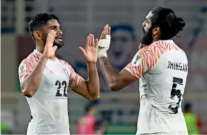  ?? AFP ?? India’s defender Sandesh Jhingan (right) celebrates with teammate Anas Edathodika after winning the match against Thailand. —