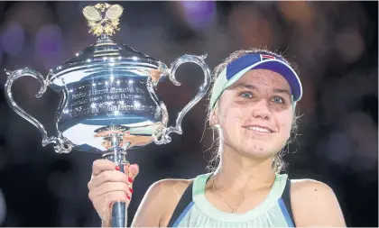  ?? REUTERS ?? Sofia Kenin celebrates with the Australian Open trophy in February.
