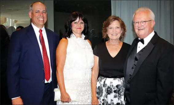  ?? NWA Democrat-Gazette/CARIN SCHOPPMEYE­R ?? Larry and Julie Shackelfor­d (from left) and Stephanie and Bill Bradley, Washington Regional Medical System chief executive officer and Vision Award recipient, gather at the 23rd Washington Regional Gala on July 15 at the Walton Arts Center in...