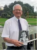  ??  ?? Wilf Malcolm holds the book he published on his sister, Margaret, who in 1982 became the first female principal of Wellington Teachers’ College.