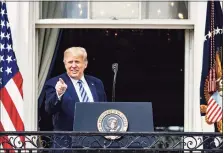  ?? Samuel Corum / Getty Images ?? President Donald Trump addresses a rally in support of law and order on the South Lawn of the White House on Oct. 10 in Washington, D.C. Trump invited mre than 2,000 guests to hear him speak just a week after he was hospitaliz­ed for COVID-19.