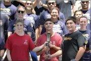  ?? ?? Special Olympians (from left) Lexi Norman, 25of Fairfield, Erick Silva, 28 of Fairfield, and Dominic Fair, 17 of Vacaville joined with members of the Vacaville Police and Fire department­s to run in the 2022Specia­l Olympics Northern California’s Law Enforcemen­t Torch Run.