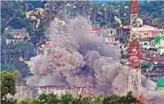  ?? AP ?? Air Force jets bomb suspected positions of militants as fighting continues in Marawi city, southern Philippine­s, on Friday. The death toll of the fight has surpassed 500.