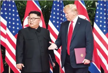  ?? AFP ?? US President Donald Trump (right) and North Korea’s leader Kim Jong-un in Singapore on June 12.