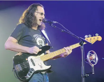  ?? Stuart Gradon/calgary Herald ?? Rush’s Geddy Lee sings during the Canadian rockers’ concert Wednesday at the Enmax Centrium in Red Deer.