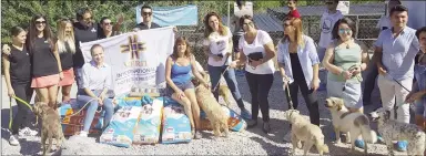  ??  ?? A group of 30 staff members of the Merit Royal and Merit Park Hotel visited the Kyrenia Animal Rescue (KAR) centre on Thursday, World Animal Day, and made a donation of 15 bags of dry dog food, 20 tins of cat food and 24 bottles of bleach.