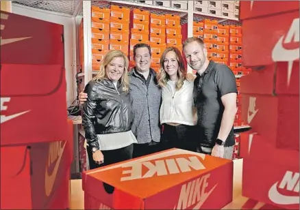 ?? Photograph­s by Myung J. Chun Los Angeles Times ?? NIKE EXECUTIVES Heidi O’Neill, left, Adam Sussman, Cathy Sparks and Michael Martin at the new Nike by Melrose. The apparel maker drilled deep into its huge customer base to pick the site for another of its retail-of-the-future experiment­s.