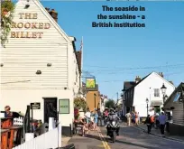  ??  ?? The seaside in the sunshine - a British institutio­n
