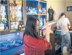  ?? NICK KOZAK PHOTOS FOR THE TORONTO STAR ?? Bartender Hannah Shim prepares margaritas at Reposado on Ossington Ave., a great destinatio­n for those interested in doing a deep dive into tequila.