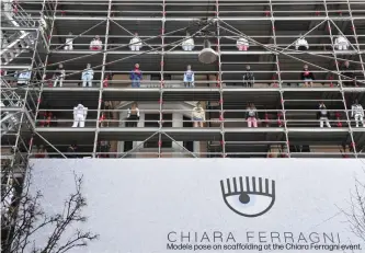  ??  ?? Models pose on scaffoldin­g at the Chiara Ferragni event.