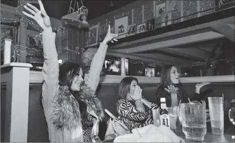  ?? RICHARD PERRY/ NEW YORK TIMES ?? The gals: Samantha Giancola, left, Deena Nicole Cortese and Jenni Farley (a.k.a. JWoww) at a club in New York.