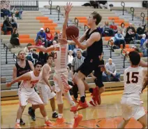  ?? OWEN MCCUE - MEDIANEWS GROUP ?? Boyertown’s Alex Obarow, right, hangs in the air Tuesday as he tries to score over Perkiomen Valley’s Tyler Lapetina.