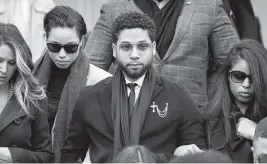  ?? BRIAN CASSELLA Chicago Tribune file, 2020 ?? Jussie Smollett departs after a court appearance at the Leighton Criminal Courts Building in Chicago. The actor is accused of orchestrat­ing a bogus racist attack in 2019.