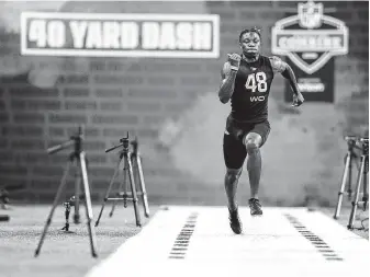  ?? Photos by Michael Conroy / Associated Press ?? Alabama receiver Henry Ruggs III ran 4.27 in the 40-yard dash despite pulling a thigh muscle.