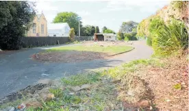 ?? Photo: Christine McKay ?? The large, empty section adjacent to St John the Baptist Anglican Church and the existing hall, which will ultimately house new offices and a hall, but a new access driveway to the former vicarage, now sold, will be built along the right-hand side first.