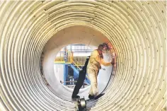  ??  ?? A worker welds a liquefied natural gas (LNG) tank at a factory in Nantong in China’s eastern Jiangsu province on March 14. — AFP photo