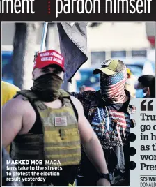  ??  ?? MASKED MOB MAGA fans take to the streets to protest the election result yesterday