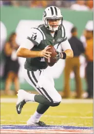  ?? Adam Hunger / Associated Press ?? New York Jets quarterbac­k Sam Darnold rolls out during the second half of a preseason game against the Atlanta Falcons on Friday.