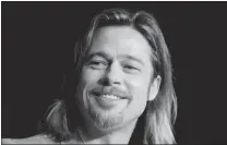  ?? ERIC GAILLARD/ REUTERS ?? Brad Pitt defends his new role as a gangster. ‘ I would have a much harder time playing something like a racist.’