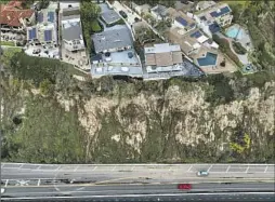 ?? Robert Gauthier Los Angeles Times ?? HOMES and unstable cliffs hang over Pacific Coast Highway in Dana Point in January. Heavy rains and big tides have damaged Orange County’s coastline.