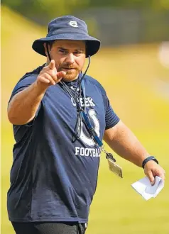  ?? STAFF FILE PHOTO BY ANGELA LEWIS FOSTER ?? Chad Barger directs a July 26 practice at Coahulla Creek. Barger resigned his post as head coach Monday.