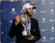  ?? FRANK FRANKLIN II — THE ASSOCIATED PRESS ?? Dustin Johnson poses with the trophy after winning the Travelers Championsh­ip golf tournament at TPC River Highlands, June 28, in Cromwell, Conn.