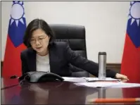  ?? The Associated Press ?? PHONE CALL: In this photo taken Friday released by Taiwan Presidenti­al Office Saturday, Taiwan's President Tsai Ing-wen speaks with U.S. President-elect Donald Trump through a speaker phone in Taipei, Taiwan.