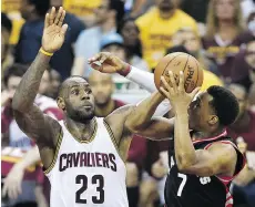  ?? FRANK GUNN/THE CANADIAN PRESS ?? Cleveland Cavaliers forward LeBron James defends against Toronto Raptors guard Kyle Lowry during the Cavaliers’ convincing 116-78 win in Game 5 on Wednesday.