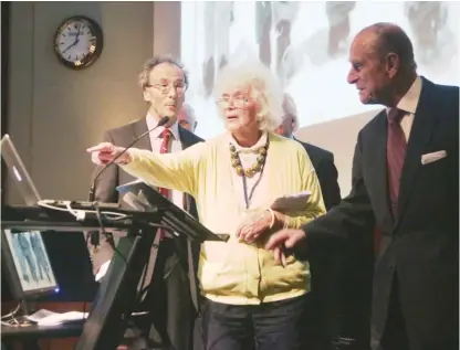  ?? YUI MOK/ PA VIA AP ?? Journalist and author Jan Morris ( center) with the Duke of Edinburgh ( right) in 2013 during a reception in London to celebrate the 60th anniversar­y of the ascent of Mt. Everest.