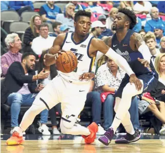  ?? — AP ?? Out of my way: Utah Jazz guard Donovan Mitchell (left) in action against Dallas Mavericks guard Wesley Matthews during the NBA game on Sunday.