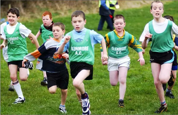  ??  ?? Niall O’Reilly, Glenmore AC (Centre) leads from the start and eventually wins the Boys U/11 race at the Blackrock AC Cross Country races held in Haggardsto­wn in February 2004.
