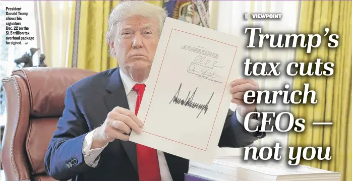  ?? | AP ?? President Donald Trump shows his signature Dec. 22 on the $ 1.5 trillion tax overhaul package he signed.