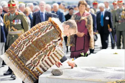  ??  ?? The Duke of York places a poppy onto the grave of Lance Sergeant Haane Manahi at a ceremony to honour the officer’s gallantry at Te Papaiouru Marae, O¯ hinemutu.