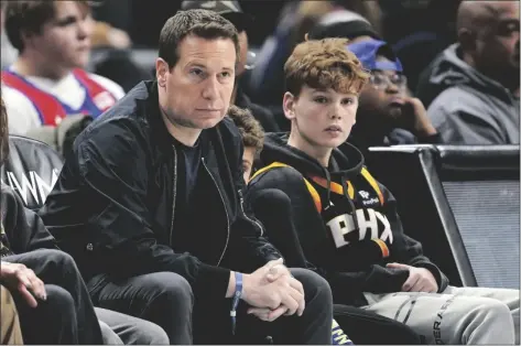  ?? AP PHOTO/PAUL SANCYA ?? Mat Ishbia (left) watches with his family during the second half of an NBA basketball game between the Phoenix Suns and Detroit Pistons in Detroit, on Feb. 4.