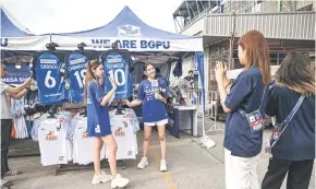  ?? ?? Rabbit Girls emceeing for social media before BG Pathum United FC’s Thai League 1 football match against Sukhothai at BG Stadium in Pathum Thani.