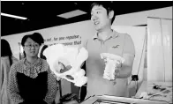  ?? JIA CHENGLONG / FOR CHINA DAILY ?? A man shows 3D printed copies of parts of human cervical spine and pelvis during a recent launch of an innovation center in Tianjin.