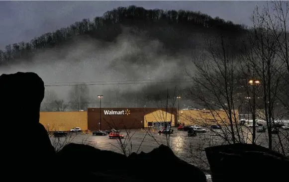  ?? MICHAEL S. WILLIAMSON PHOTOS/THE WASHINGTON POST ?? The Walmart in Kimball, W.Va., became a vision of bountiful modernity after the town lost its coal mines. For shoppers who rejoiced when it opened a decade ago, the closure is harsh.