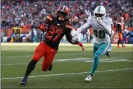  ?? JEFF HAYNES - THE ASSOCIATED PRESS ?? Browns running back Kareem Hunt avoids Dolphins defensive back Nik Needham for a touchdown during a Nov. 24 game.