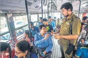  ?? PRATIK CHORGE/HT PHOTO ?? Neeraj Singh Rathore (in blue) takes a bus from his home in southweste­rn Mumbai’s Kalina, followed by a local train, and then an autoricksh­aw to reach his office in northern Mumbai’s Kandivali