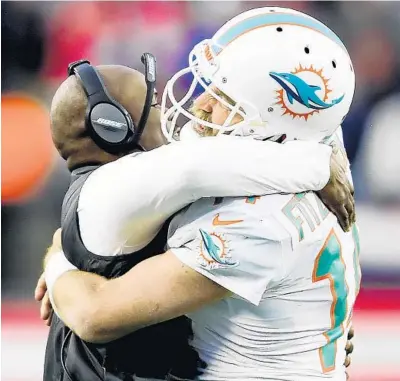  ?? BILLIE WEISS/GETTY ?? Quarterbac­k Ryan Fitzpatric­k, right, said he is rooting for the success of first-round draft pick Tua Tagovailoa.