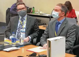  ?? Court TV video images / Associated Press ?? Defense attorney Eric Nelson, left, and former police officer Derek Chauvin listen as Judge Peter Cahill presides over pretrial motions before opening statements in Chauvin’s trial in Minneapoli­s.